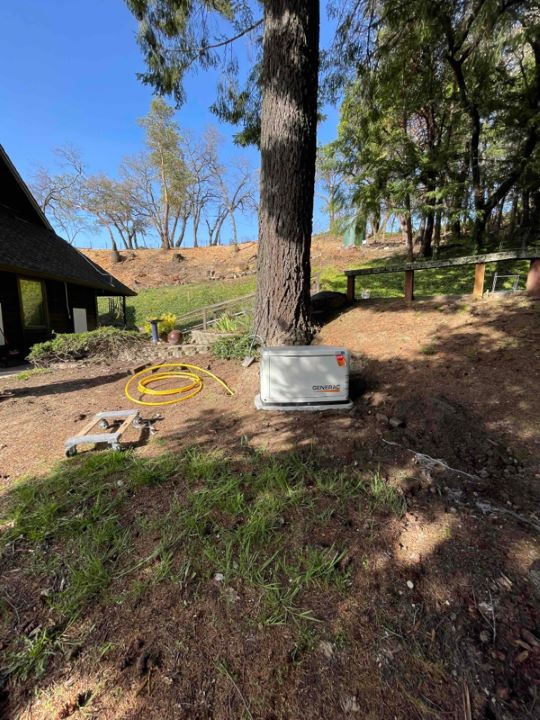 Generac backup battery installed in the yard of a residential clients house