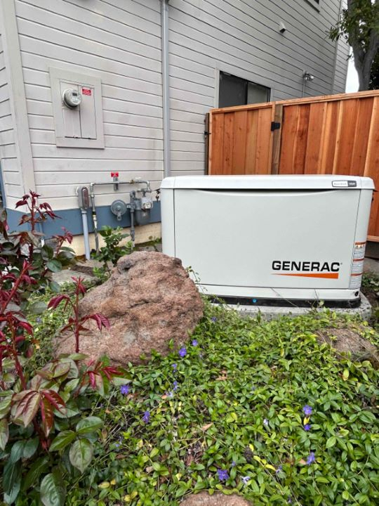 Generac generator installed on the side of a residential customers house